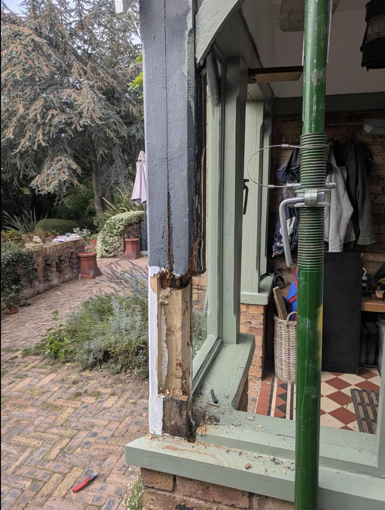 Damaged porch timber before repair